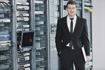 Image showing young engeneer in datacenter server room