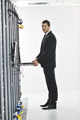 Image showing young engeneer in datacenter server room