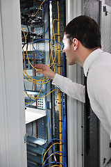 Image showing young engeneer in datacenter server room