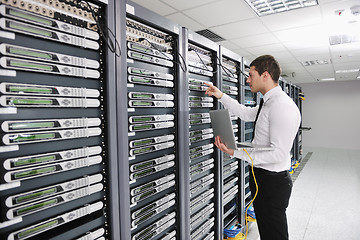 Image showing young engeneer in datacenter server room