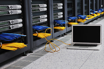 Image showing laptop computer at server network room