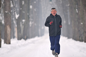 Image showing one older man running at alley 