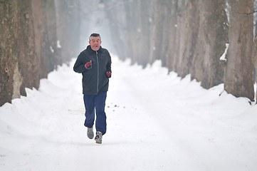 Image showing one older man running at alley 