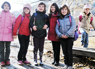 Image showing school girls running away