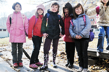 Image showing school girls running away