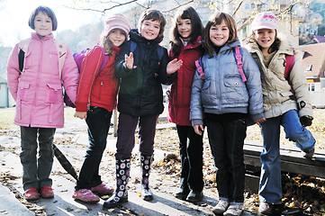 Image showing school girls running away