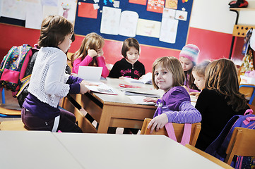 Image showing happy kids with  teacher in  school classroom