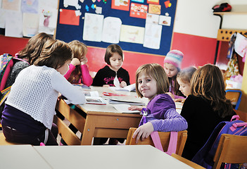 Image showing happy kids with  teacher in  school classroom