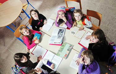 Image showing happy kids with  teacher in  school classroom