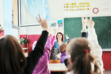 Image showing happy kids with  teacher in  school classroom