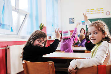 Image showing happy kids with  teacher in  school classroom