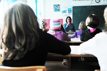 Image showing happy kids with  teacher in  school classroom