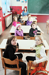 Image showing happy kids with  teacher in  school classroom