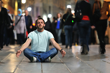 Image showing young man meditating yoga in lotus position