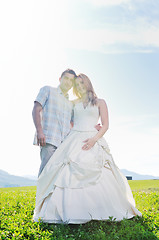 Image showing beautiful bride outdoor with colorful windmill toy