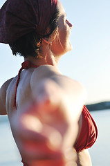 Image showing happy girl spreading hands and enjoy in sunlight