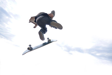 Image showing Boy practicing skate in a skate park - isolated