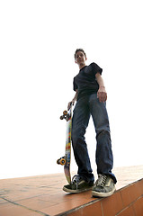 Image showing Boy practicing skate in a skate park - isolated