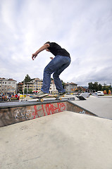 Image showing Boy practicing skate in a skate park - isolated