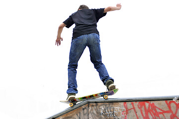 Image showing Boy practicing skate in a skate park - isolated