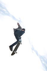 Image showing Boy practicing skate in a skate park - isolated