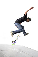 Image showing Boy practicing skate in a skate park - isolated
