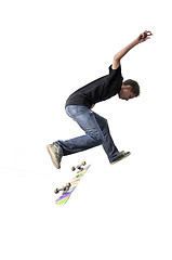 Image showing Boy practicing skate in a skate park - isolated