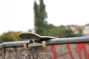 Image showing Skate board left behind in park