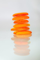 Image showing isolated wet zen stones with splashing  water drops  