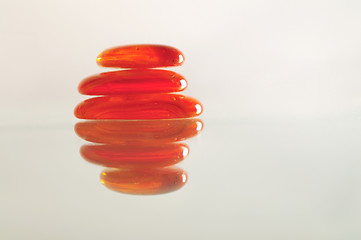 Image showing isolated wet zen stones with splashing  water drops  