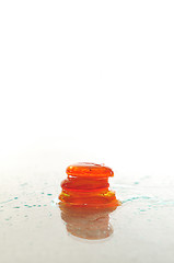 Image showing isolated wet zen stones with splashing  water drops  