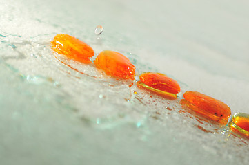 Image showing isolated wet zen stones with splashing  water drops  