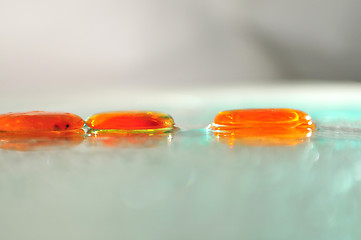 Image showing isolated wet zen stones with splashing  water drops  