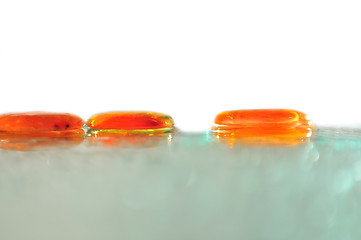 Image showing isolated wet zen stones with splashing  water drops  