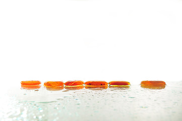 Image showing isolated wet zen stones with splashing  water drops  