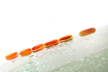 Image showing isolated wet zen stones with splashing  water drops  