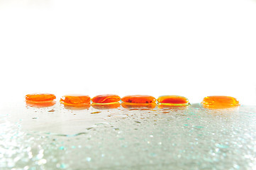 Image showing isolated wet zen stones with splashing  water drops  