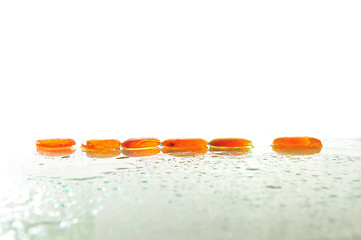 Image showing isolated wet zen stones with splashing  water drops  