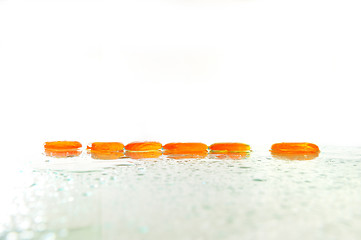 Image showing isolated wet zen stones with splashing  water drops  