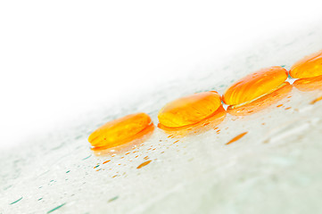 Image showing isolated wet zen stones with splashing  water drops  