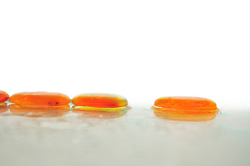 Image showing isolated wet zen stones with splashing  water drops  