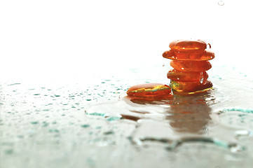 Image showing isolated wet zen stones with splashing  water drops