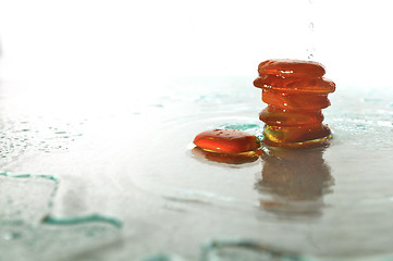 Image showing isolated wet zen stones with splashing  water drops