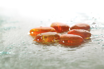 Image showing isolated wet zen stones with splashing  water drops