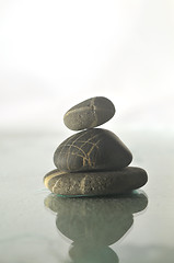 Image showing isolated wet zen stones with splashing  water drops