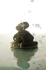 Image showing isolated wet zen stones with splashing  water drops