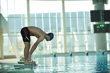 Image showing young swimmmer on swimming start