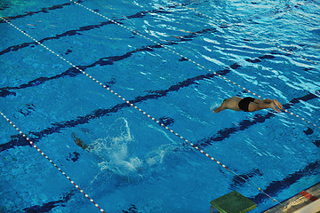 Image showing young swimmmer on swimming start