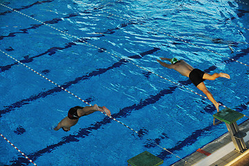 Image showing young swimmmer on swimming start