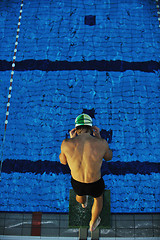 Image showing young swimmmer on swimming start